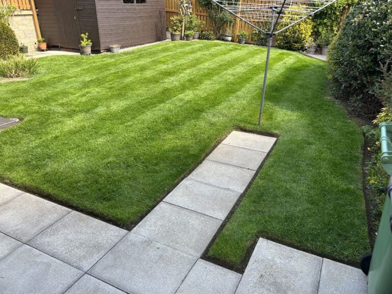 Striped residential lawn maintained by Emerald Green Lawn Care in Arbroath